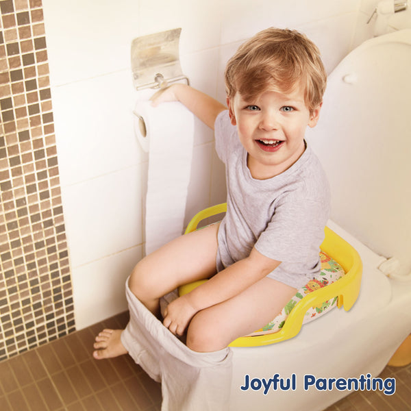 Baby sitting on cushioned toilet training seat